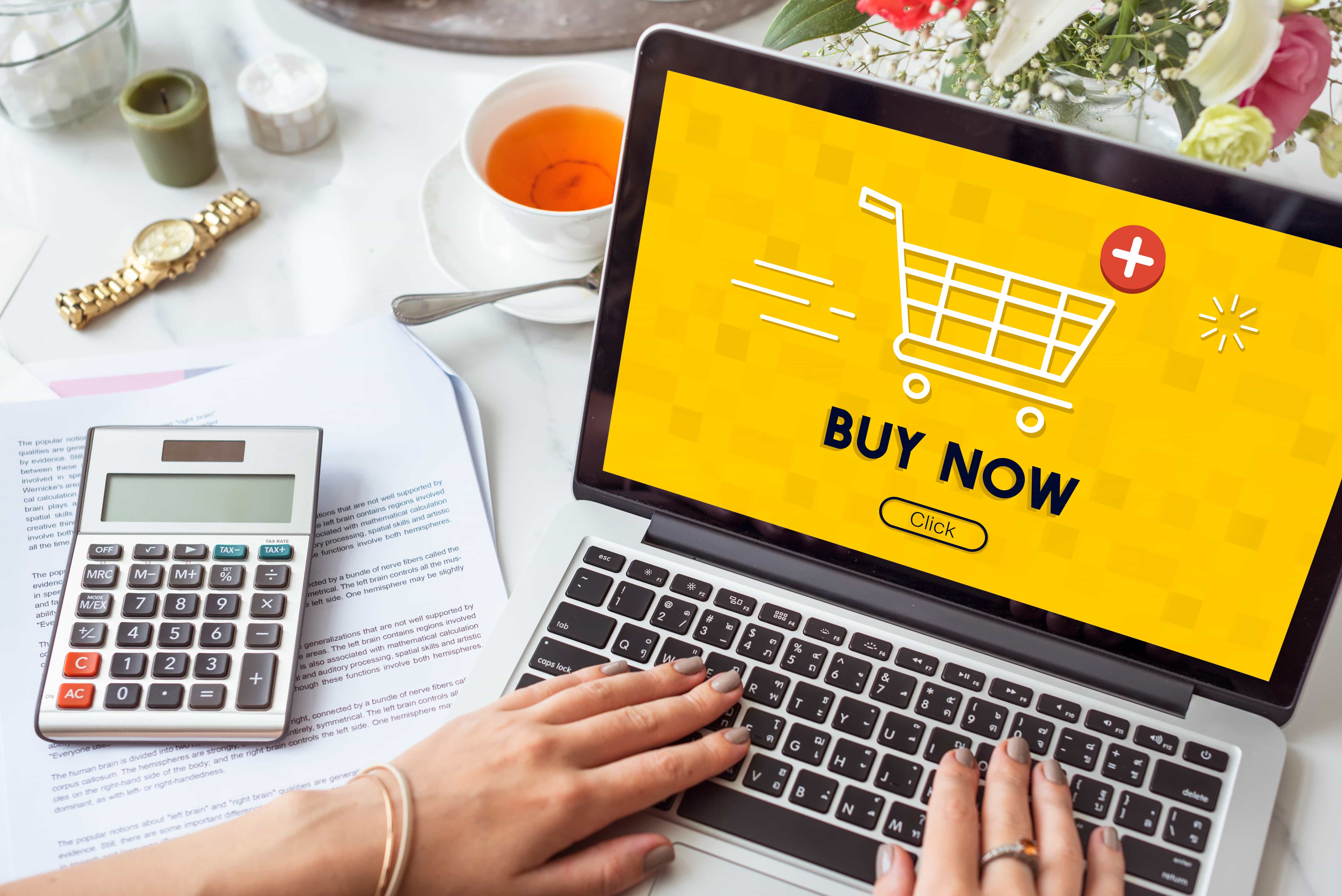 A laptop opens and purchasing something online